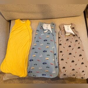 Kyte baby sleep backs  - Yellow is .5, trucks is 1.0 and the hedgehogs is 2.5